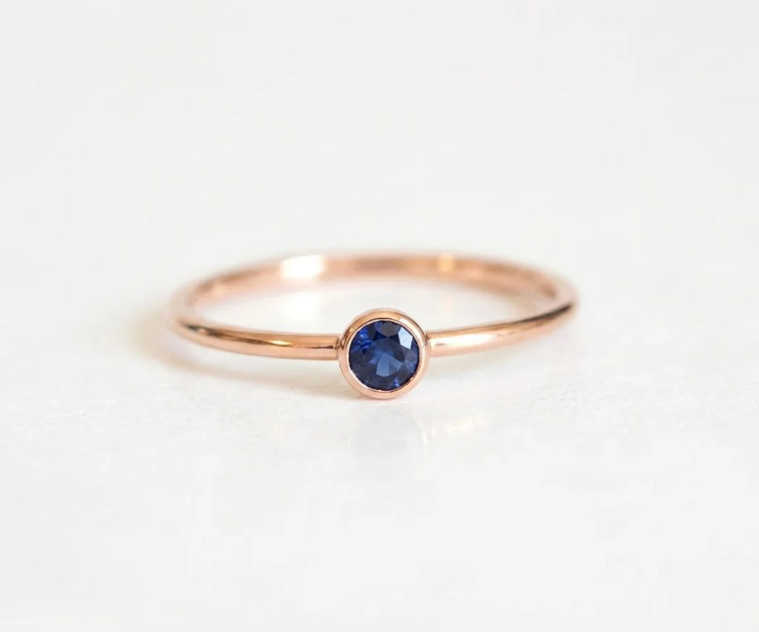 Elegant blue sapphire engagement ring with sparkling diamond halo in white gold setting