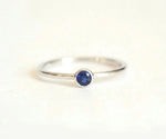 Oval blue sapphire engagement ring with diamond band for a timeless bridal look
