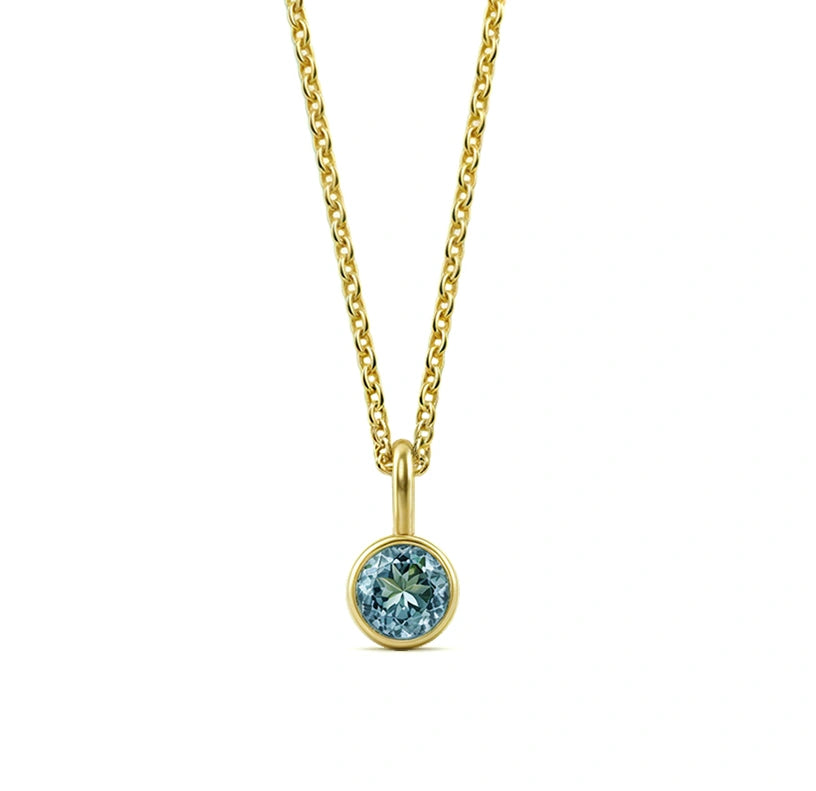 This blue topaz birthstone necklace features a cool sky-blue gemstone set in a delicate pendant necklace for women.

