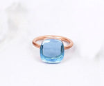 Blue topaz engagement ring with a radiant gemstone and timeless appeal
