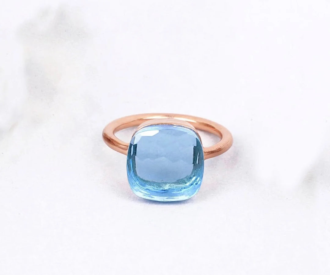Blue topaz engagement ring with a radiant gemstone and timeless appeal