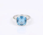 Stunning blue topaz gemstone ring featuring a vibrant sky blue stone for women
