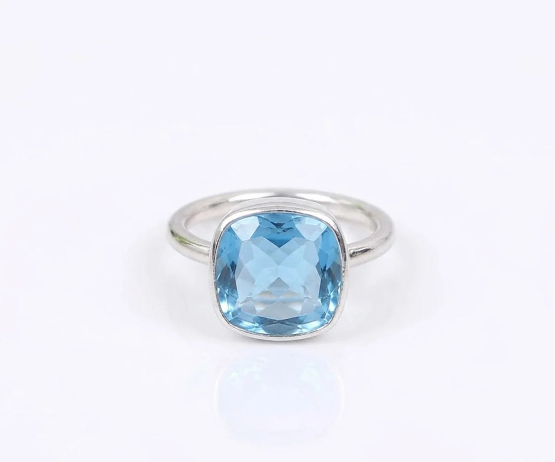 Stunning blue topaz gemstone ring featuring a vibrant sky blue stone for women