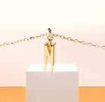 Fine gold necklace showcasing the letter “N”, a delicate piece to mark your signature look.
