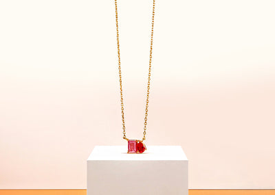 Toi et Moi necklace with tourmaline and ruby gemstones, symbolizing toi et moi meaning you and me in a romantic two-stone design

