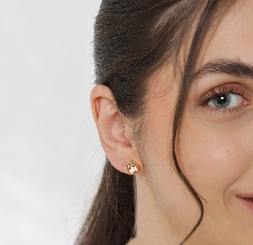 Soft blush morganite stud earrings radiating feminine charm and subtle sparkle.

