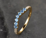Stunning blue topaz bridal ring featuring a vibrant gemstone for modern weddings

