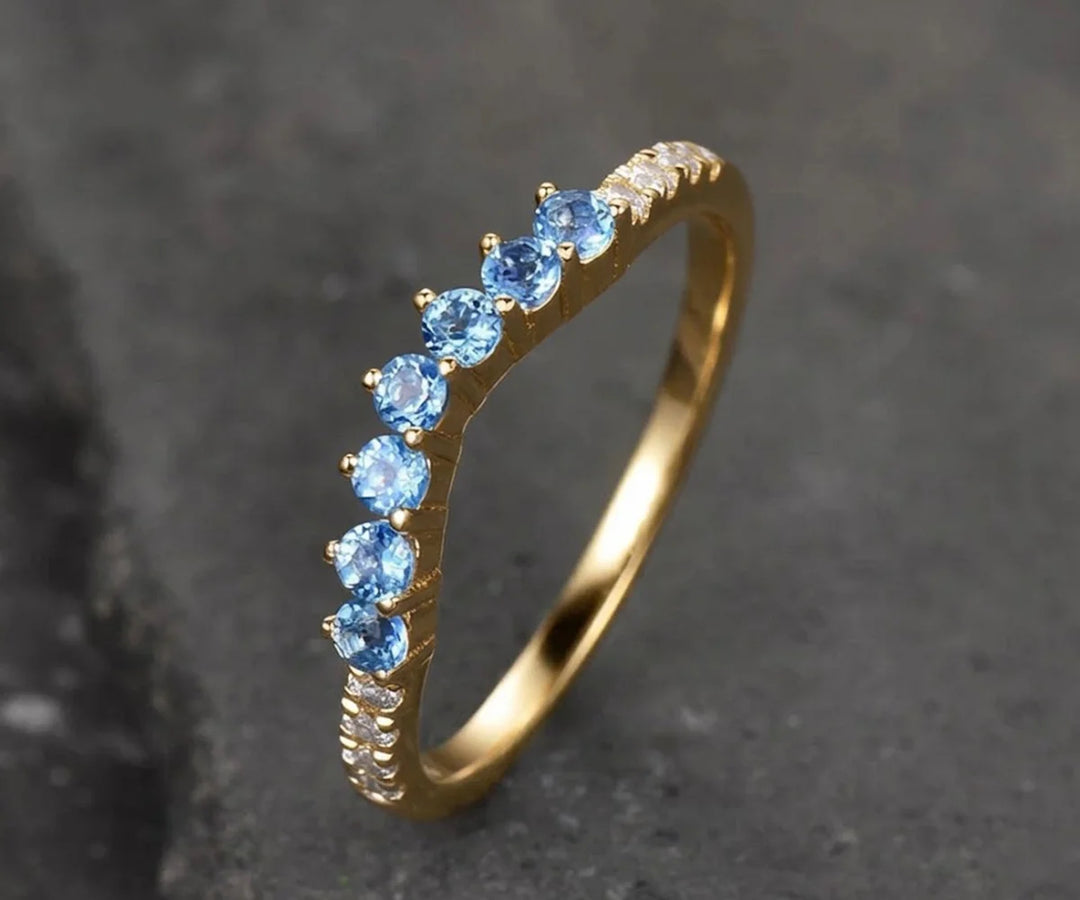 Stunning blue topaz bridal ring featuring a vibrant gemstone for modern weddings