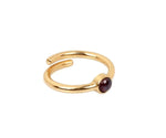 Deep raspberry gemstone set in a delicate elegant band, perfect for January birthstone jewelry lovers
