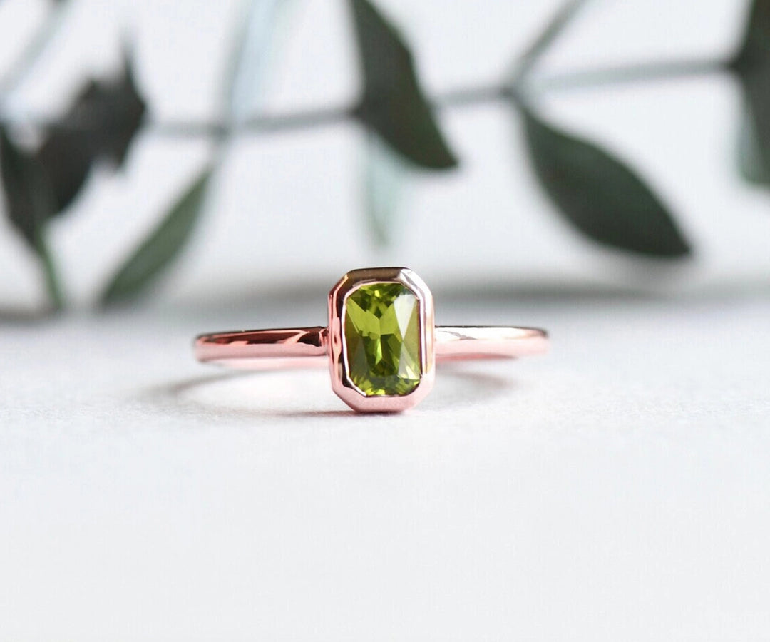 Peridot wedding ring featuring a vivid green peridot gemstone in a meaningful design, symbolizing love, harmony, and new beginnings.
