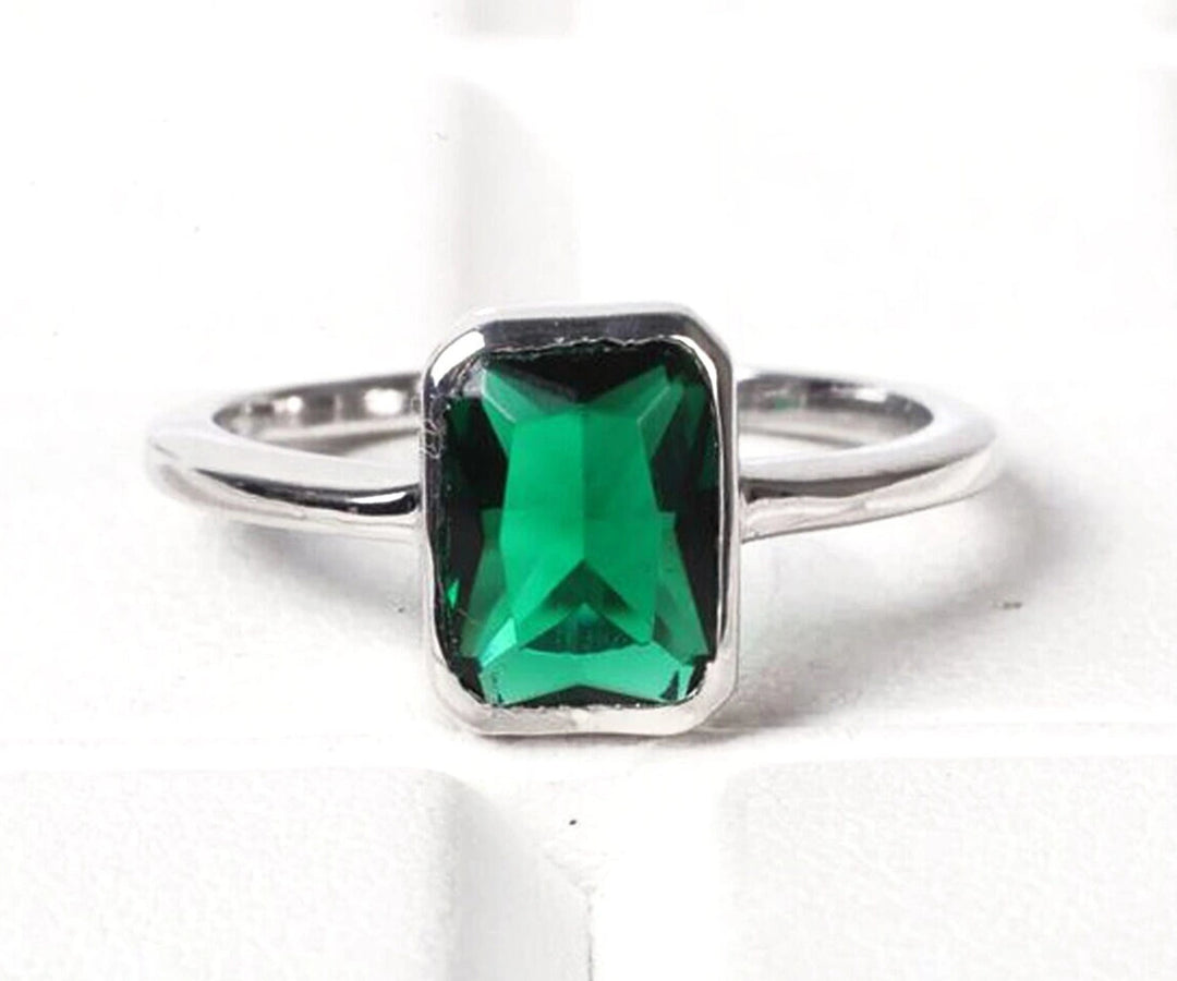Elegant solid silver ring with a radiant emerald hydro stone, blending timeless charm and modern sophistication
