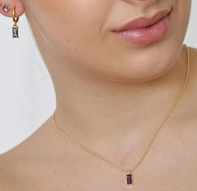 Dainty amethyst gemstone necklace on a gold chain, perfect for gifting or everyday wear.
