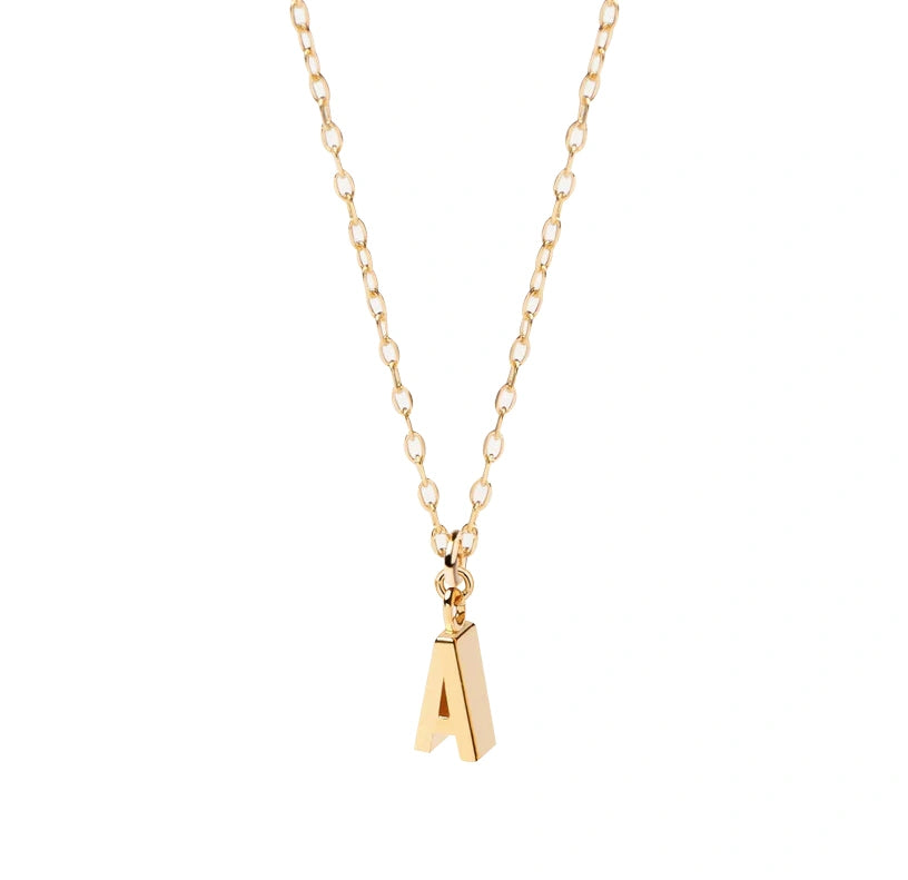 Close-up of dainty gold letter A necklace, gracefully dangling from a fine anchor chain, capturing a soft glow perfect for a personal, everyday look.