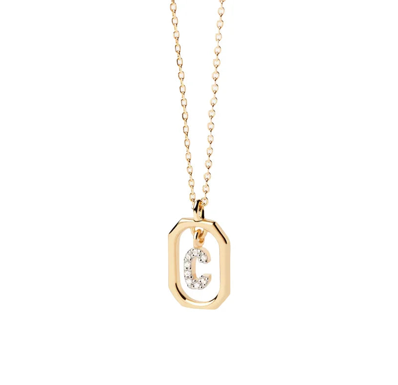 A C initial necklace gold featuring a polished letter “C” pendant on a delicate gold chain, creating a personalized and elegant jewelry piece.