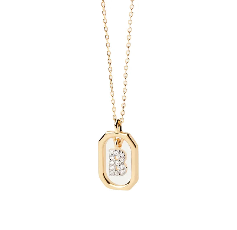Diamond initial pendants featuring sparkling diamonds set in personalized letter charms on delicate chains, adding a luxurious and elegant touch.