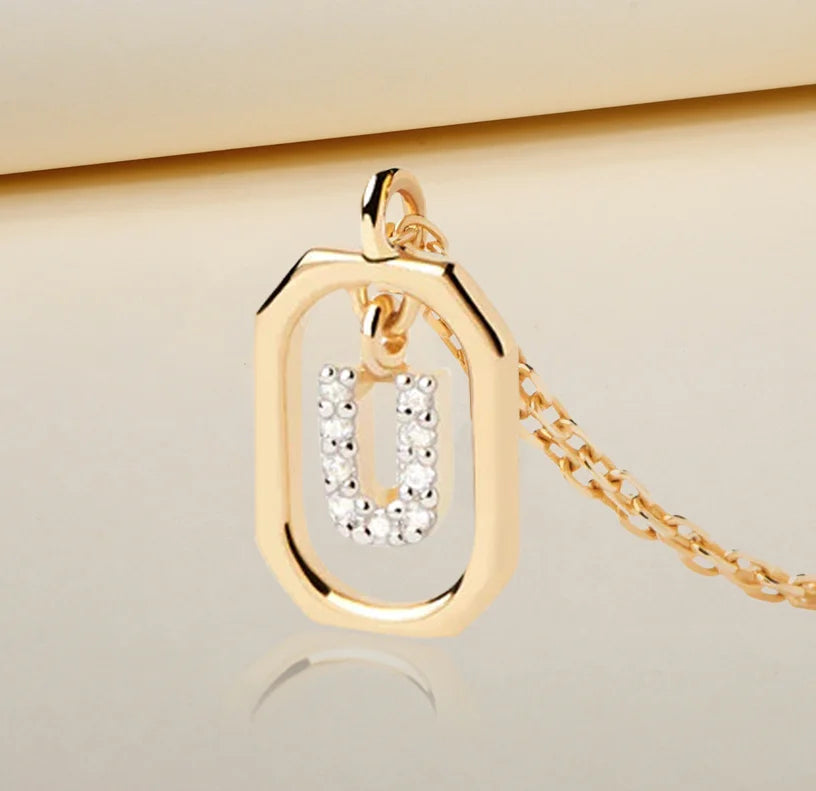 An elegant initial pendant featuring a polished letter charm on a delicate chain, adding a simple and personalized touch to everyday style.