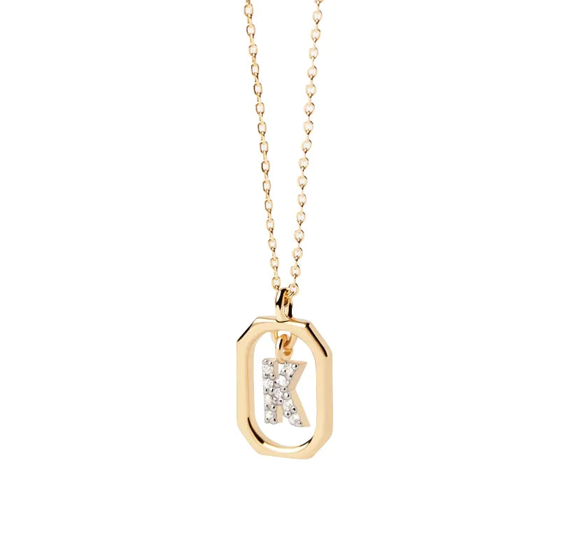 A letter K necklace gold featuring a polished “K” pendant on a delicate gold chain, offering a personalized and elegant jewelry piece.