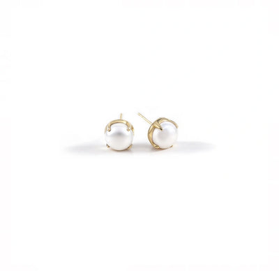 Oversized 10mm freshwater pearl studs on display