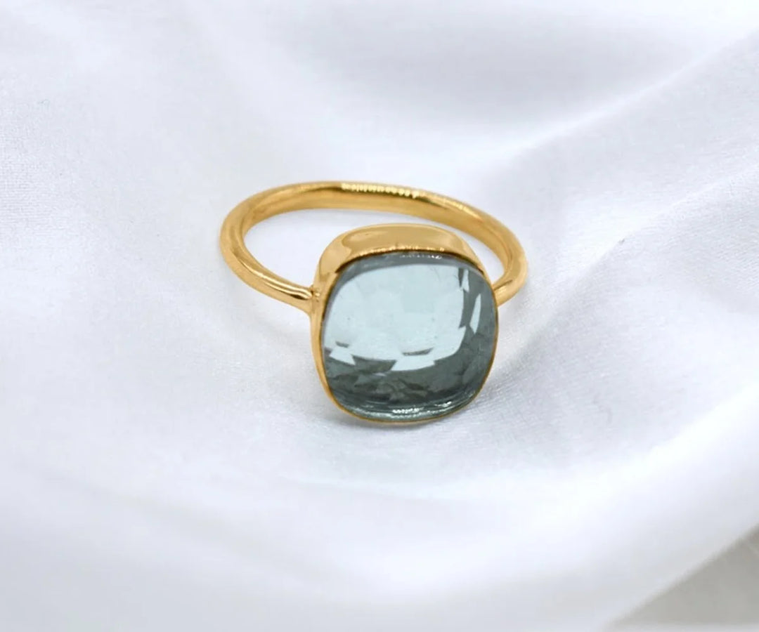 Dainty aquamarine stackable ring for women featuring a soft blue gemstone accent