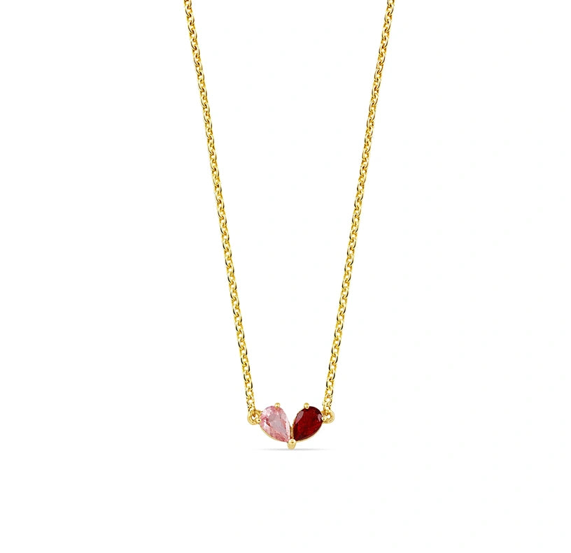 Pear Toi et Moi necklace with pink tourmaline and ruby blaze stones in a heart-shaped duet on a gold-plated adjustable chain. 
