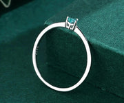 Nature-inspired sterling silver heart ring with a green aquamarine center, weighing under 1 gram.