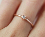 Floral zircon ring design with delicate petal pattern and sparkling stones
