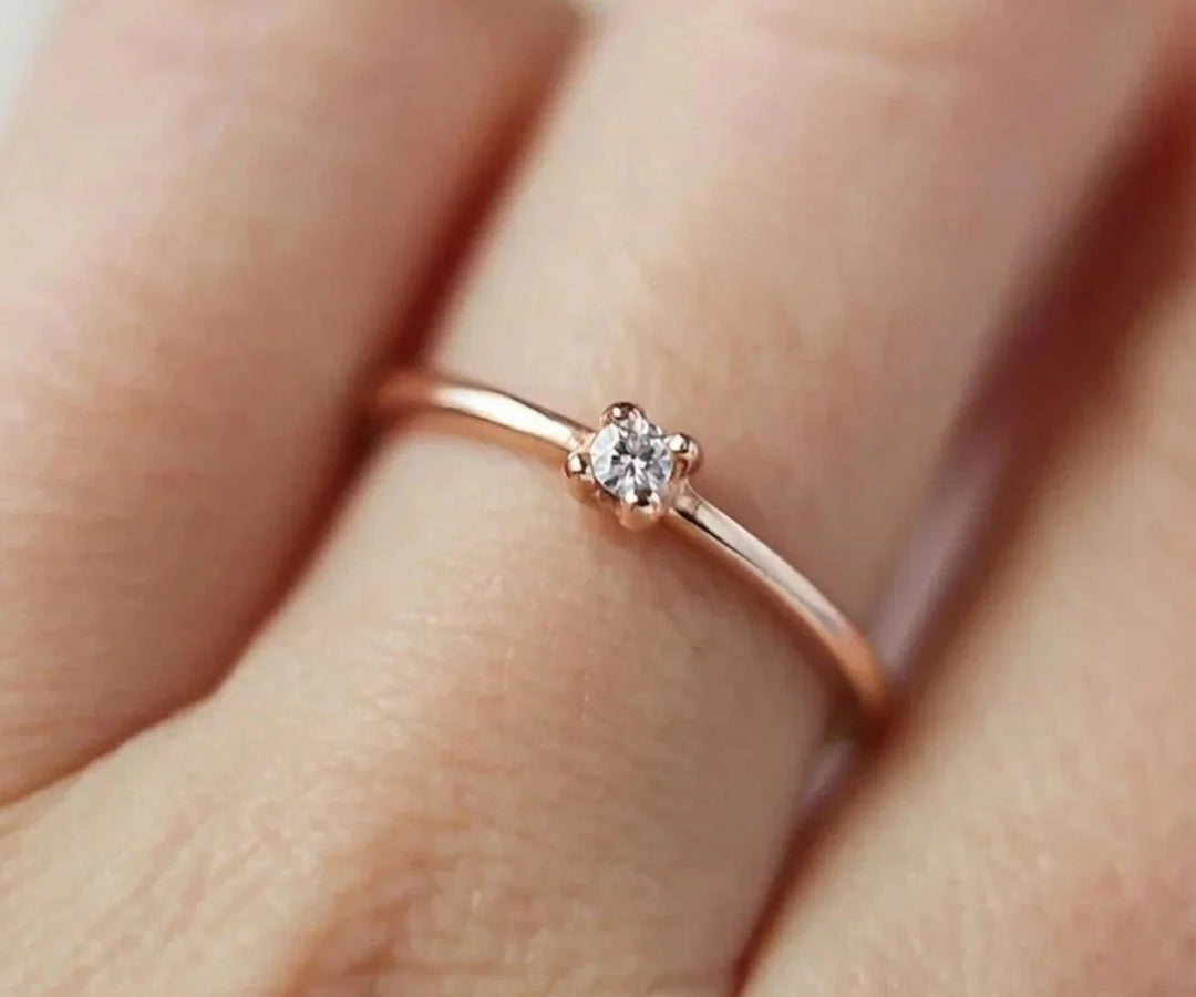 Floral zircon ring design with delicate petal pattern and sparkling stones