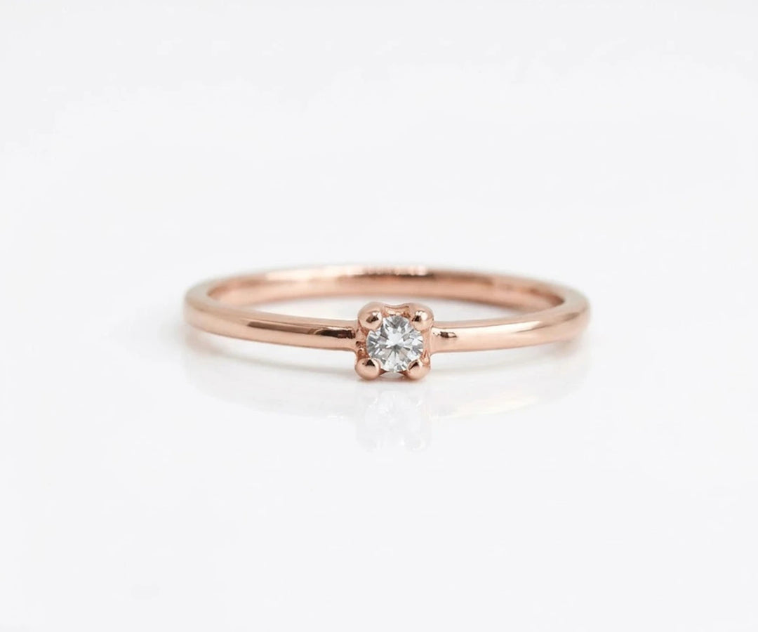 Halo zircon ring featuring center stone surrounded by small shimmering accents