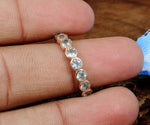 Aquamarine engagement ring with shimmering blue stone and elegant band
