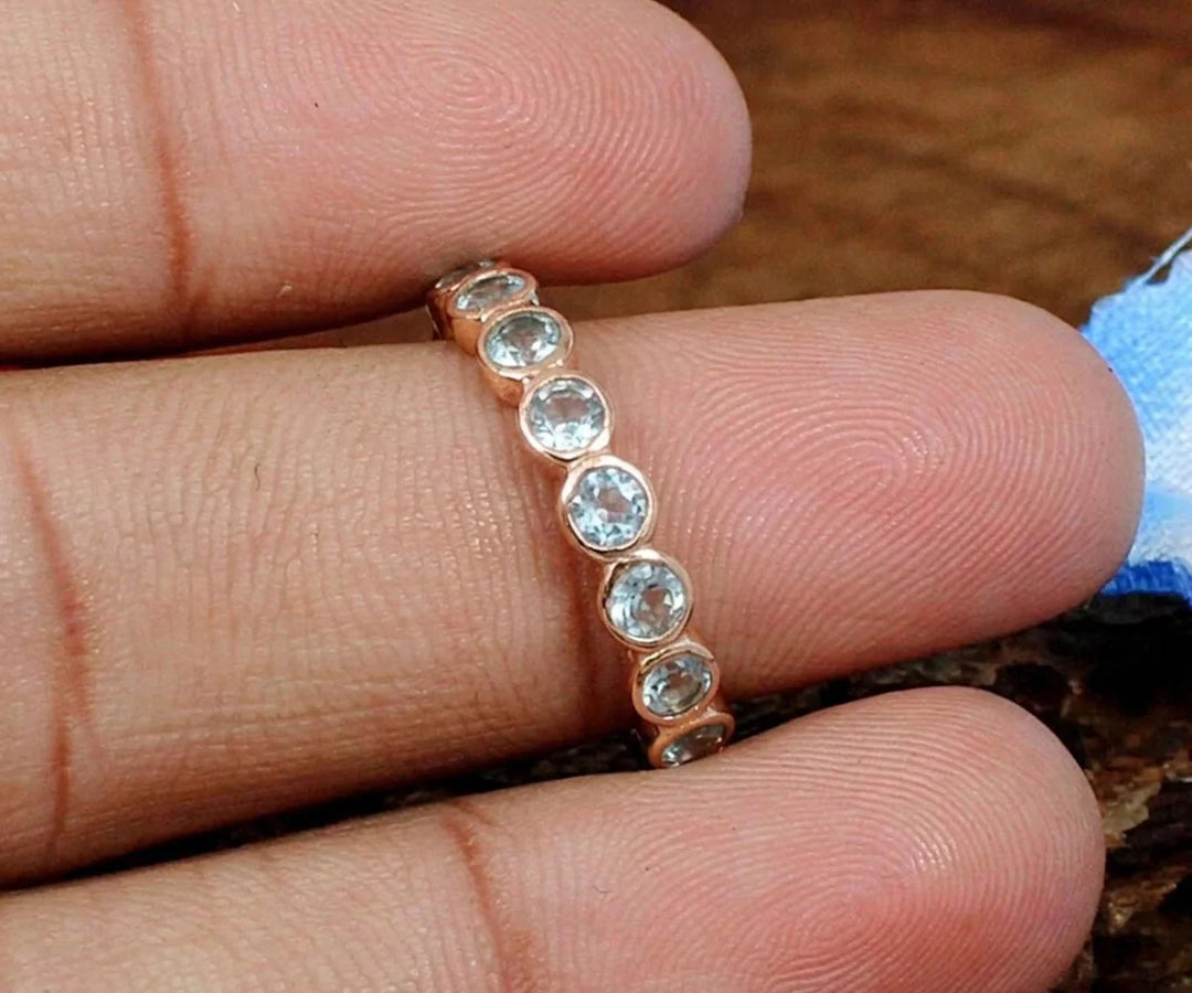 Aquamarine engagement ring with shimmering blue stone and elegant band
