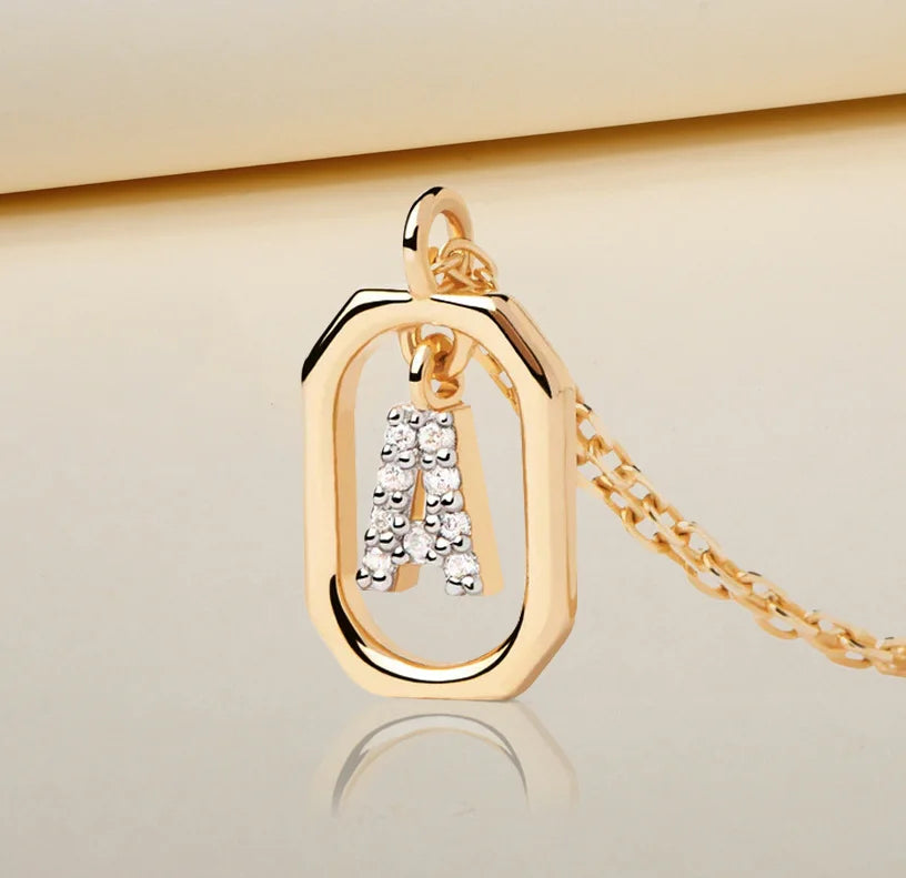 An initial necklace A featuring a polished letter “A” pendant on a delicate chain, creating a personalized and elegant jewelry piece.