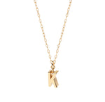 Minimalist gold letter K pendant necklace with a delicate anchor chain and secure clasp, perfect for layering or wearing solo.  Initial Necklace
