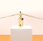 Elegant gold letter "D" pendant on a dainty adjustable chain, radiating personal charm and minimalist beauty.
