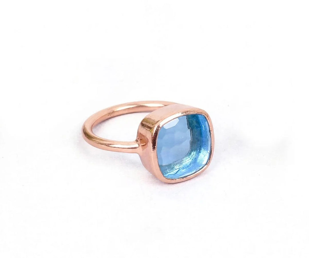 Luxury blue topaz ring with polished band and eye-catching blue gemstone centerpiece