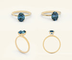 Sterling silver teal sapphire ring with prong-set oval gemstone and no side stones
