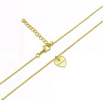 Delicate gold heart charm necklace inscribed with 'Mama' in script font — a timeless Mother's Day gift. 
