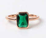 Vintage-inspired lab emerald ring featuring a rich green center stone
