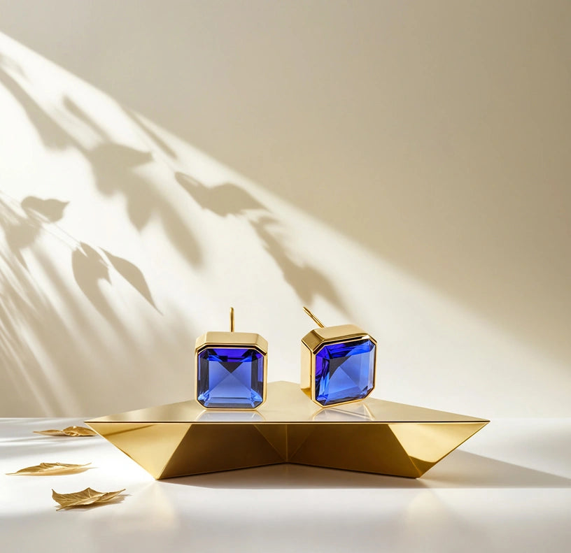 Stylish 10mm Asscher cut Blue Sapphire studs in yellow gold plating.