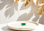 Elegant Emerald Quartz pendant with 16.5mm gold-plated design on a 15-inch chain.
