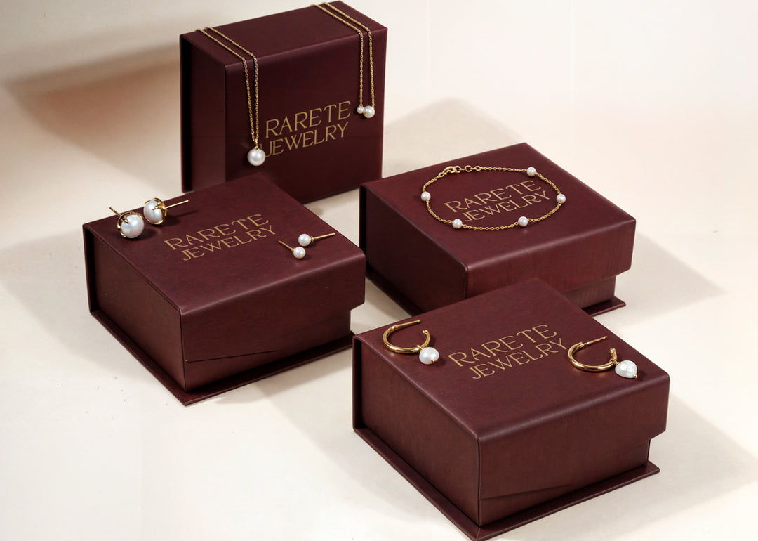 Lightweight gold hoops with dangling freshwater pearls