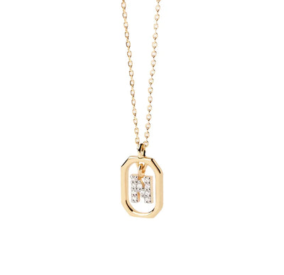 An N pendant featuring a polished letter “N” charm on a delicate chain, creating a simple and personalized jewelry piece.