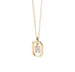 An N pendant featuring a polished letter “N” charm on a delicate chain, creating a simple and personalized jewelry piece.
