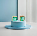 Stylish 10mm Asscher cut Emerald Quartz studs in yellow gold plating.
