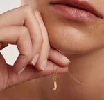 Gold dainty necklace with the letter J pendant, gracefully suspended from a sleek adjustable anchor chain for a touch of personalized shine.
