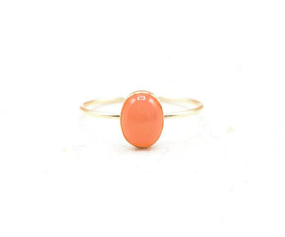 Handcrafted moonstone ring in gold-filled or silver, featuring a glowing 8x6mm gemstone with earthy red-orange tones.


