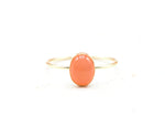 Handcrafted moonstone ring in gold-filled or silver, featuring a glowing 8x6mm gemstone with earthy red-orange tones.



