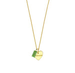 A peridot pendant necklace featuring a bright green gemstone set in a delicate, polished design that adds a fresh and elegant touch to any look.
