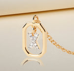 Elegant personalized necklace featuring the letter X in zircon on a gold-plated adjustable chain
