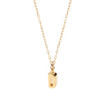 Chic and dainty initial "D" necklace in glowing gold, perfect for layering or gifting with love.
