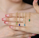 A necklace with birthstones featuring colorful gemstone charms that represent loved ones, creating a meaningful and elegant personalized jewelry piece.
